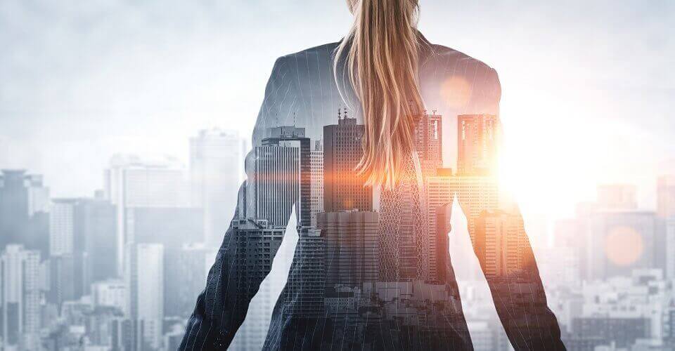 Businesswoman looking at buildings